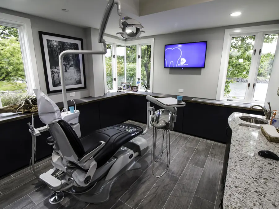 A treatment room at Westport Dental Associates, with windows onto the river.