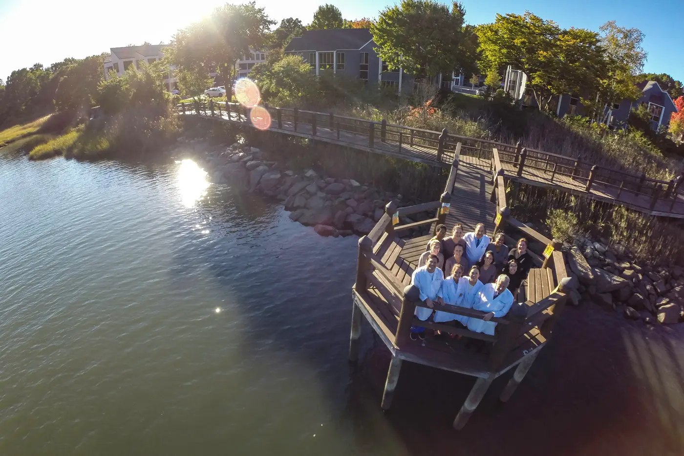 The whole Westport Dental Associates team on the dock over the Saugatuck River.