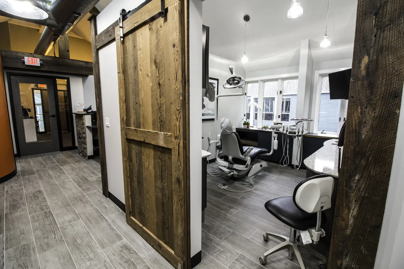 A sliding barn door opening onto the treatment bays.