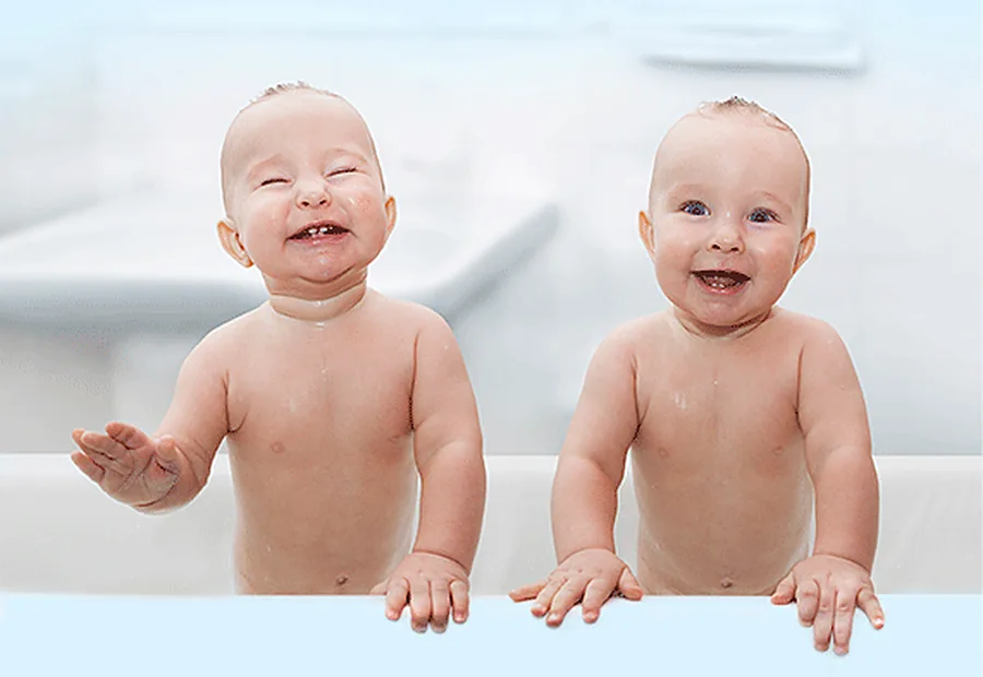 Two babies, around the age of a first dental visit.